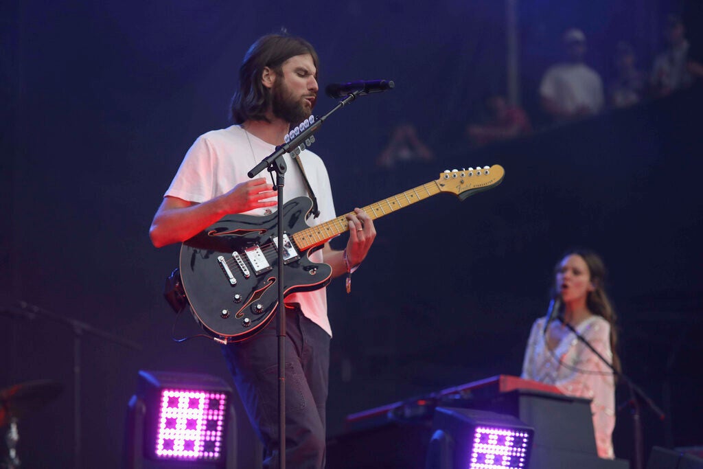 Matt Quinn, left, and Jackie Miclau from the band Mt. Joy perform on stage