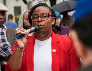 New Jersey Rep. LaMonica McIver speaks into a microphone outside of an immigrant detention center in Newark, New Jersey