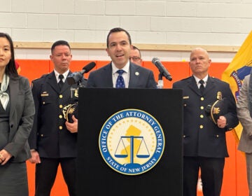 New Jersey Attorney General Matt Platkin speaks at a podium