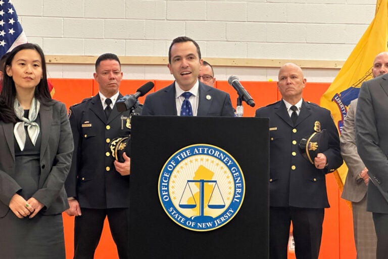 New Jersey Attorney General Matt Platkin speaks at a podium