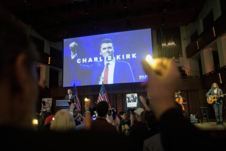 APTOPIX Charlie Kirk Prayer Vigil People hold candles and sing during a memorial and prayer vigil for Charlie Kirk at the John F. Kennedy Memorial Center for the Performing Arts, Sunday, Sept. 14, 2025, in Washington. (AP Photo/Rod Lamkey, Jr.)