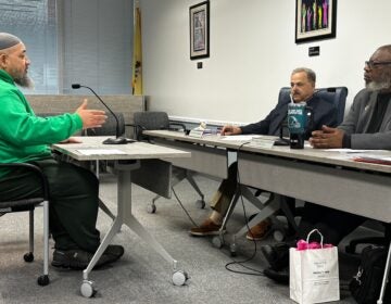 Faheem Lea addressing State Board of Education member Jack Fornaro and Board Vice President Nedd James Johnson with his concerns about the Camden City School District during public testimony