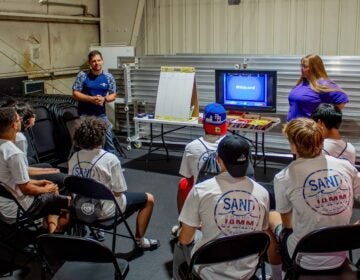 Instructors at Cape Assist interact with students