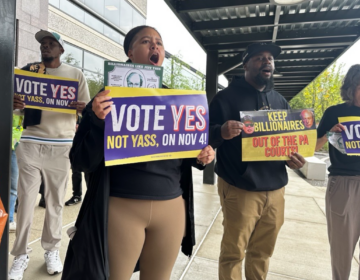People holding up signs at a protest