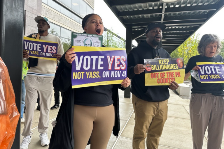 People holding up signs at a protest