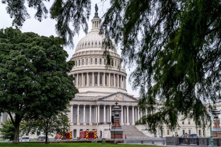 Congress members discussing government shutdown during legislative session