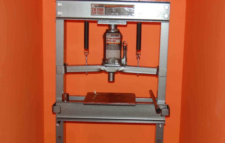 a machine used to press adulterated drugs into kilogram bricks