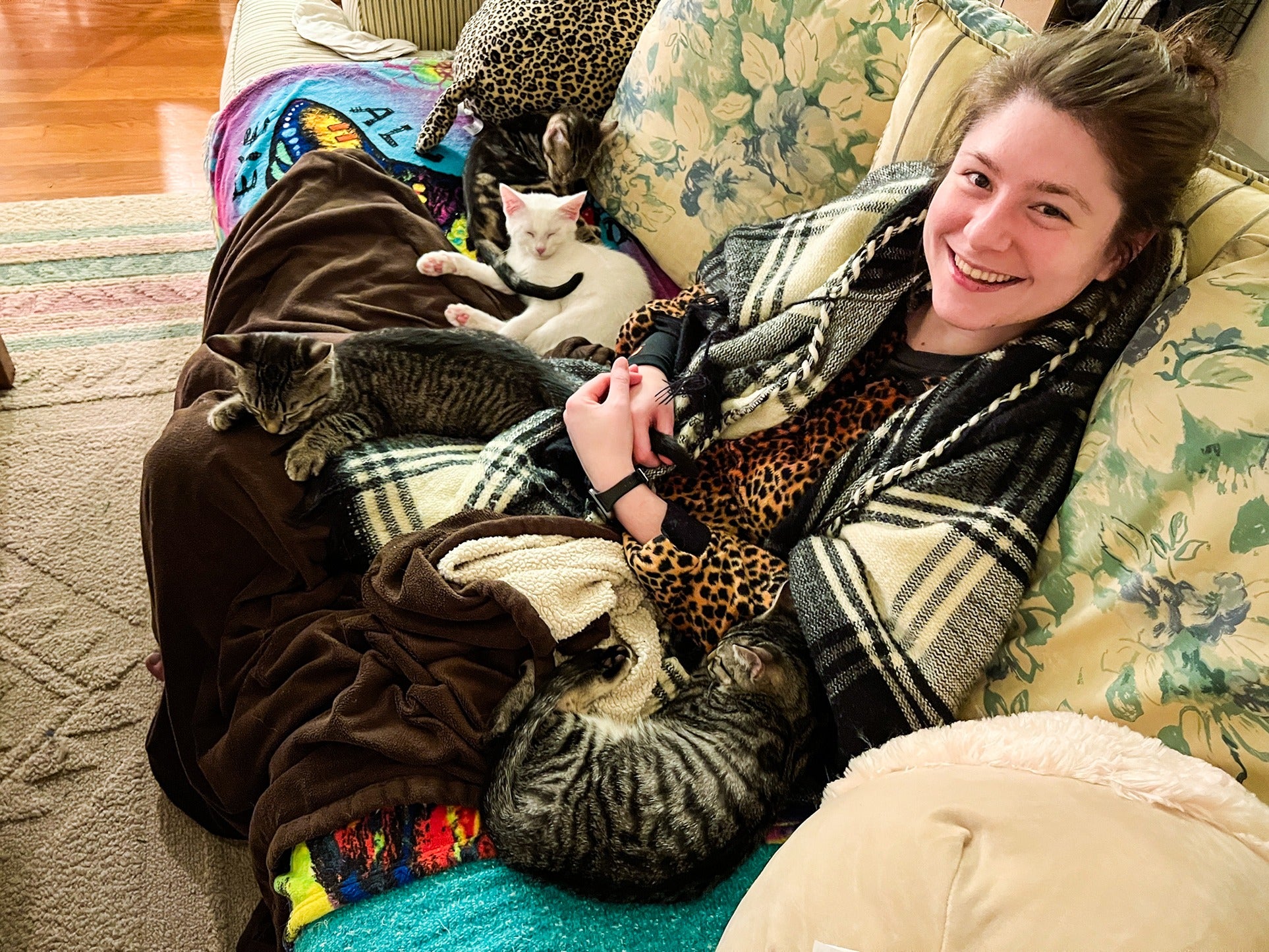 Sierra RyanWallick smiles next to her cats