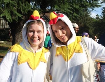 Phoebe Berner, left, and Dominique Van Gilst dressed in chicken costumes for Moorestown's first annual Hessian Fun Run.