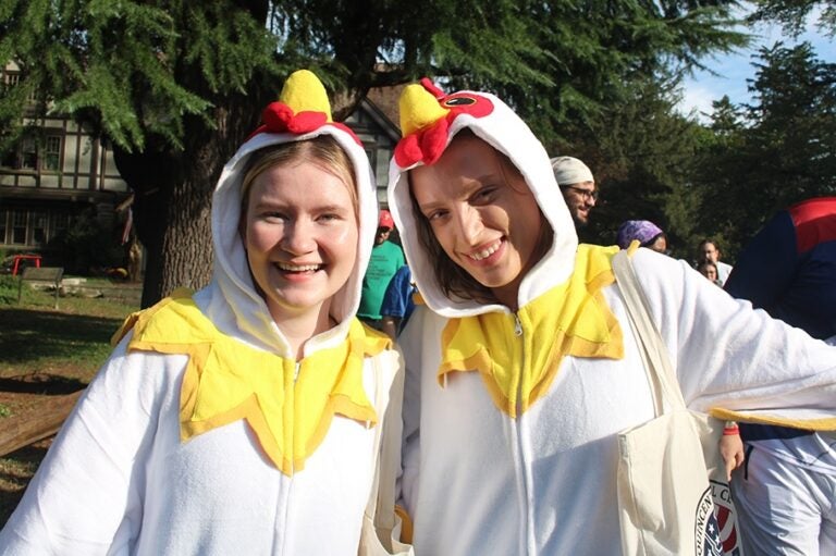 Phoebe Berner, left, and Dominique Van Gilst dressed in chicken costumes for Moorestown's first annual Hessian Fun Run.