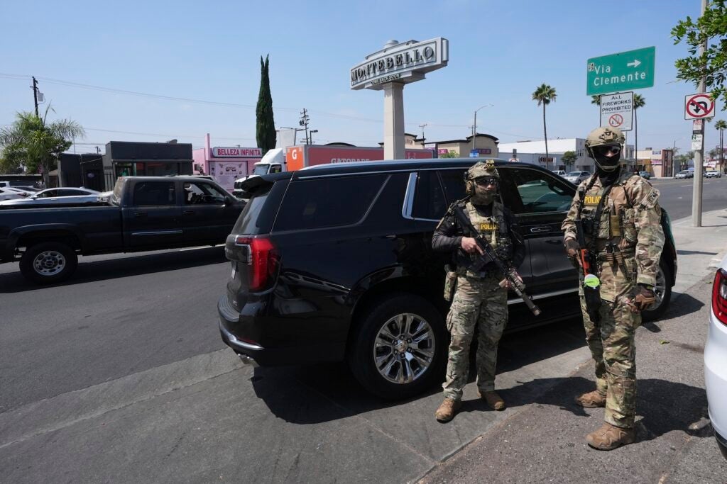 Immigration agents conduct an operation at a car wash