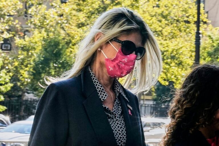 Menendez Bribery Nadine Menendez wearing a face mask as she walks into the courthouse