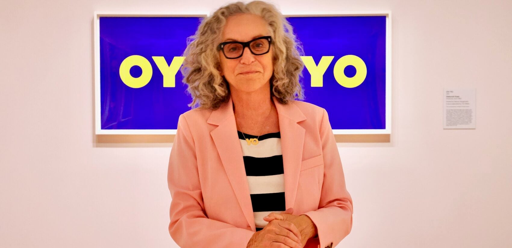 2025 09 10-e lee-deborah kass-philadelphia museum of art-brand x screenprinting exhibit oyyo Deborah Kass stands before her ''OY/YO'' print
