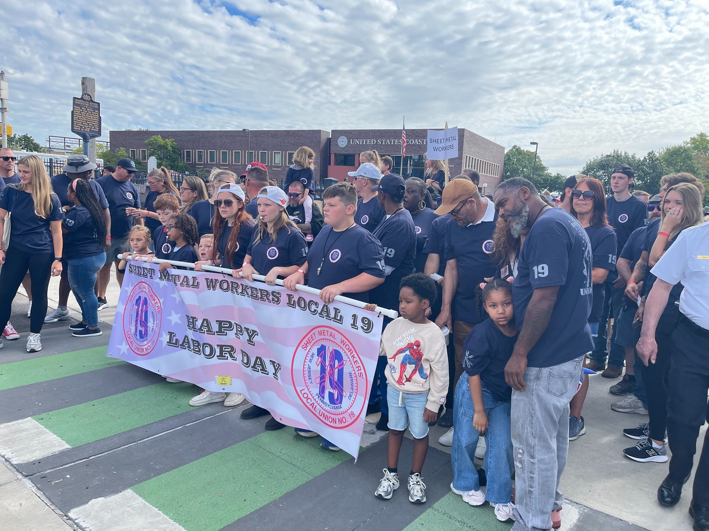 Sheet Metal Workers union members prepare to march