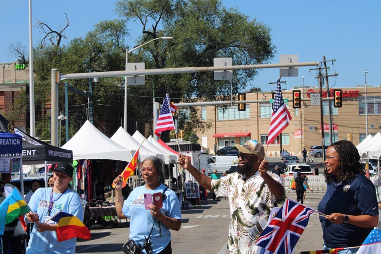 Upper Darby Mayor Ed Brown and Delaware County Chair Dr. Monica Taylor lead a parade of flags at Upper Darby's International Festival