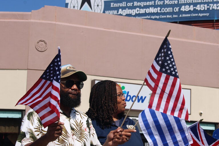 Upper Darby Mayor Ed Brown and Delaware County Chair Dr. Monica Taylor lead a parade of flags at Upper Darby's International Festival