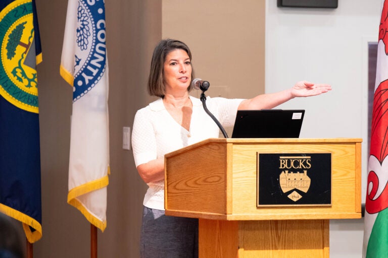 Tracy Timby, vice president of workforce and strategic partnerships at Bucks County Community College, speaks at a podium