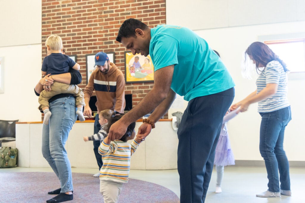 Parents dance with children at dance class