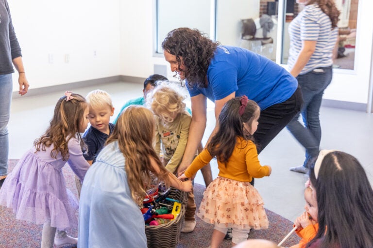 10 31 2025 k paynter 1200x music together princeton lab school-4 Norah Wasden cleans instruments with toddlers