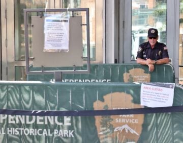 A private security guard stands at the entrance to the Liberty Bell Center, which has been closed to the public since the shutdown of the federal government on Oct. 1.