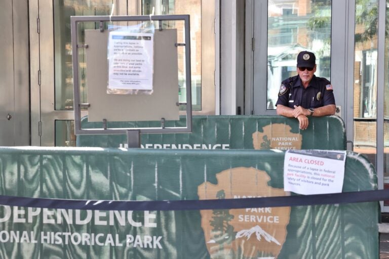 2025 10 07-e lee-philadelphia independence national historical park-private security A private security guard stands at the entrance to the Liberty Bell Center, which has been closed to the public since the shutdown of the federal government on Oct. 1.