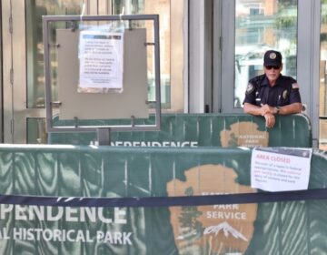 A private security guard stands at the entrance to the Liberty Bell Center, which has been closed to the public since the shutdown of the federal government on Oct. 1.