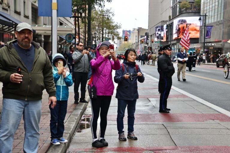 Spectators line Market Street to watch a parade