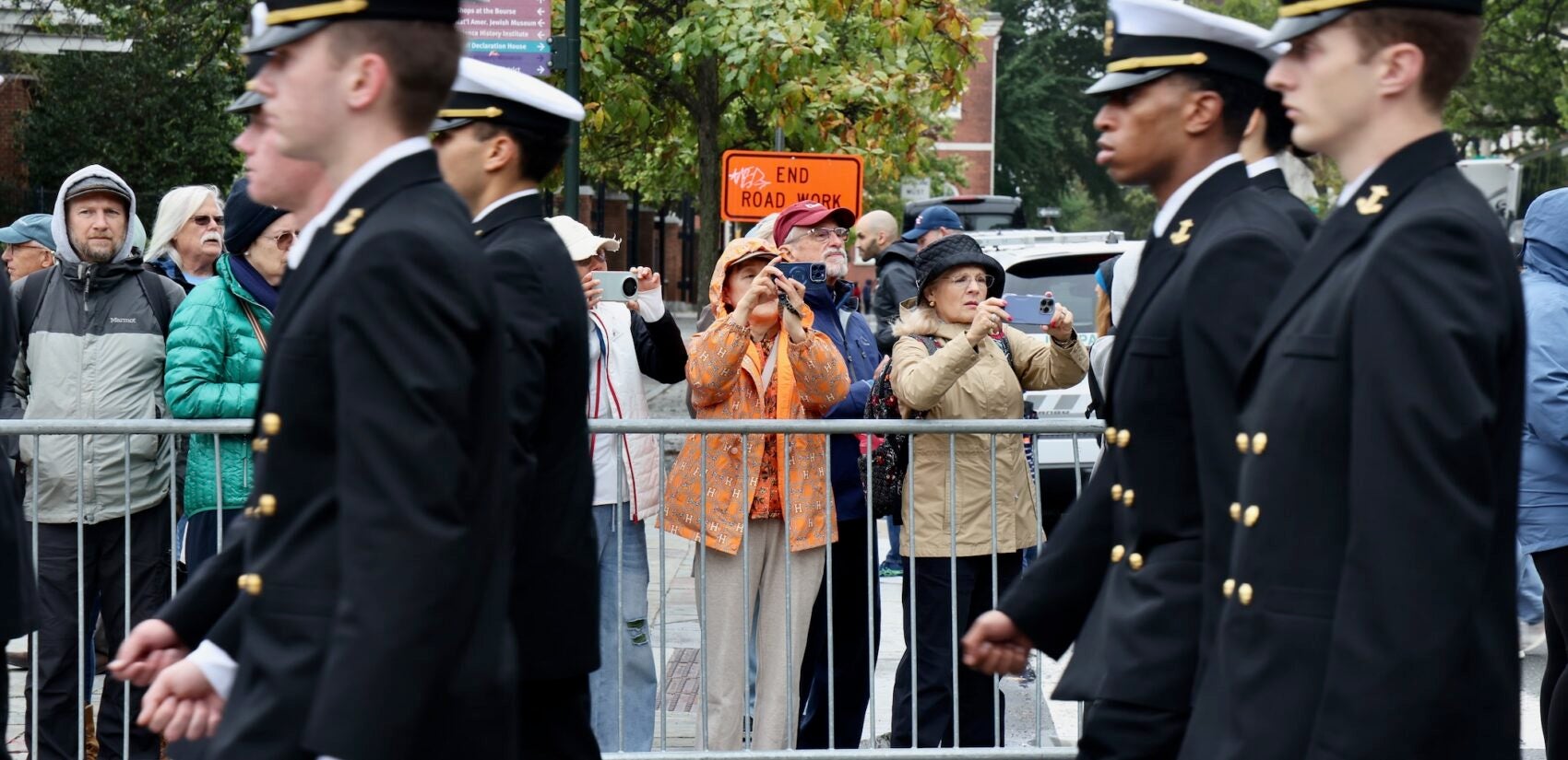 2025 10 13-e lee-philadelphia-navy marines 250th parade spectators navy officers Spectators line Market Street to watch the Navy and Marine Corps 250th parade