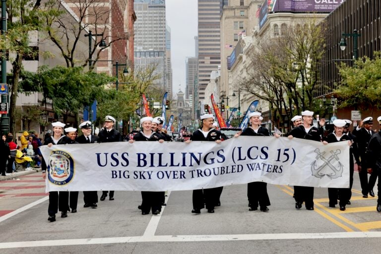 Members of the crew of the USS Billings march