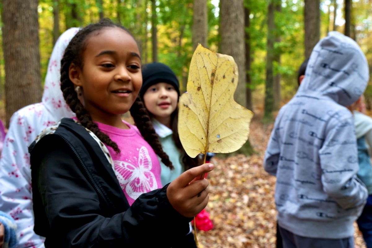 2025 10 28-e lee-nivaeh rivera-croydon pa keystone elementary school-nature club leaf Nivaeh Rivera admires a leaf she discovered in the Croydon Woods