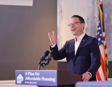 Pennsylvania Gov. Josh Shapiro stands and speaks at a podium
