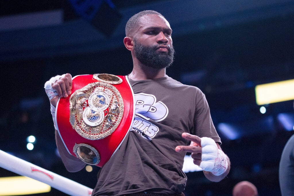 Jaron Ennis gestures after defeating Karen Chukhadzhian in an IBF World Welterweight title bout