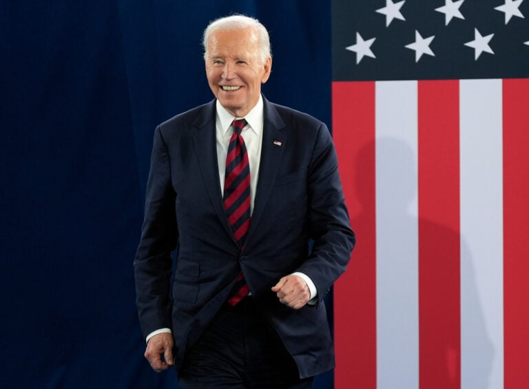 Biden-Cancer Former President Joe Biden stands in front of an American flag