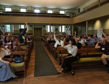 Quakers-Youthful Appeal Quakers raise their hands after a worship service at the historic West Room of the Arch Street Meeting House in Philadelphia