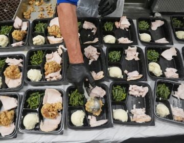 APTOPIX US Government Shutdown-SNAP A volunteer prepares meals at the Philabundance Community Kitchen in Philadelphia, Thursday, Oct. 30, 2025.