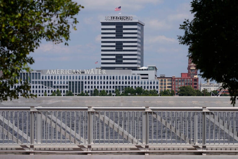 american-water-new-jersey copy The largest regulated water and wastewater utility company in the U.S., American Water, its building in Camden, N.J., seen in the foreground on June 17, 2024. The company is merging with Essential Utilities. (AP Photo/Matt Slocum, File)