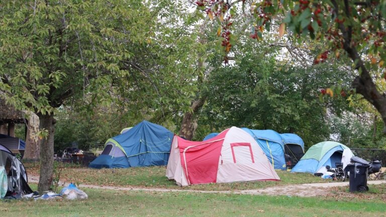 Tents cover the grounds of Christina Park
