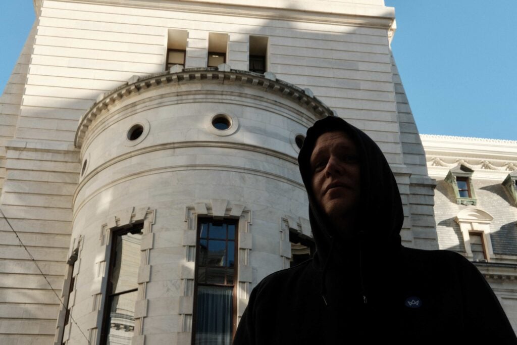 David Behney looks on