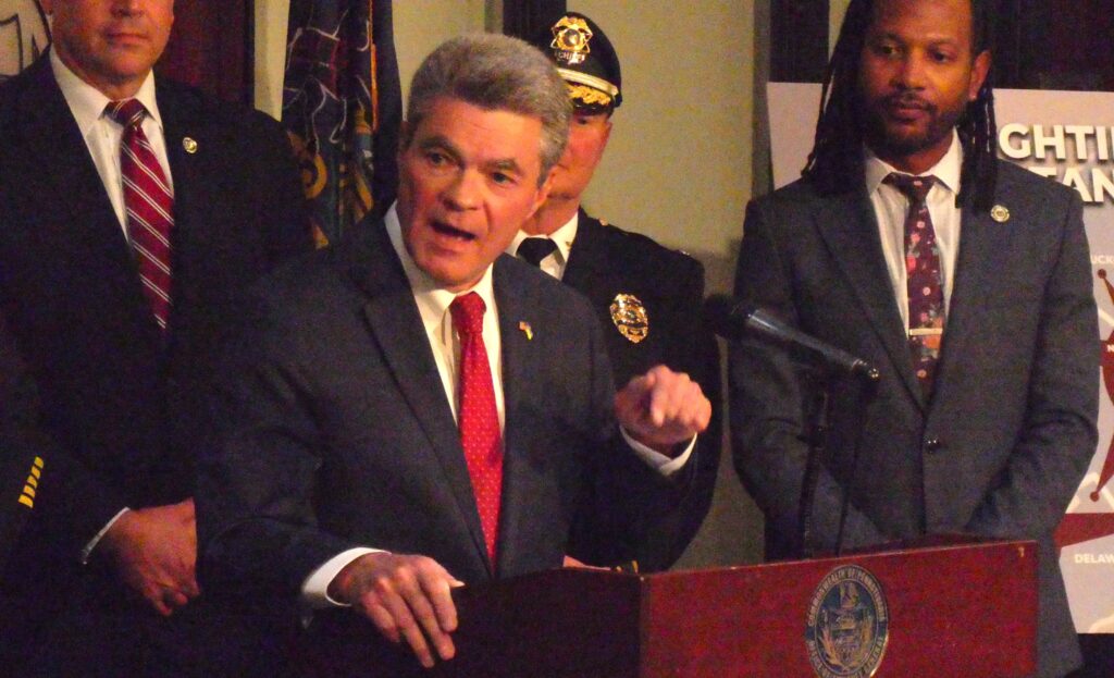 Jack Stollsteimer speaking at a podium