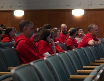 Teachers, wearing red, are seen at the Haverford school board meeting on Oct. 9, 2025