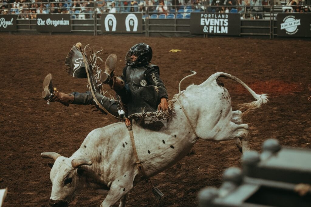Kamal Miller rides a bull 