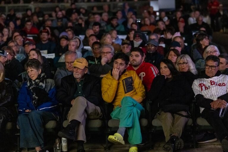 Attendees listen to a conversation