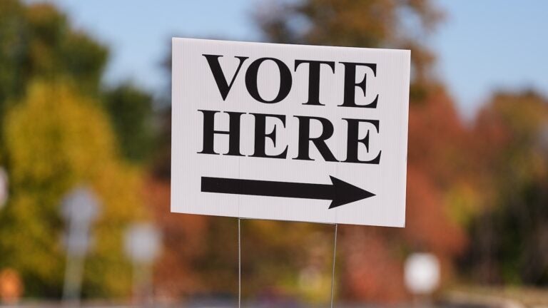 A ''Vote Here'' sign indicates a polling place at Rowan College in Mount Laurel, N.J., Monday, Oct. 27, 2025.