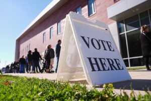 Voters wait in line to cast their ballots at a polling place at Rowan College in Mount Laurel, N.J., Monday, Oct. 27, 2025.