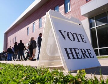 Voters wait in line to cast their ballots at a polling place at Rowan College in Mount Laurel, N.J., Monday, Oct. 27, 2025.