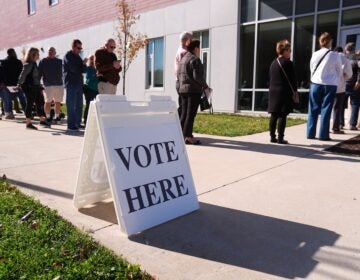 Voters wait in line to cast their ballots at a polling place at Rowan College in Mount Laurel, N.J., Monday, Oct. 27, 2025.