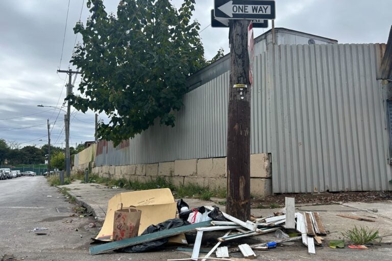 Trash and debris left on a street corner