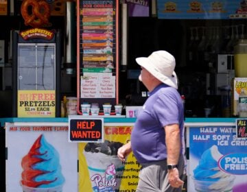 A person walks on Ocean City's boardwalk