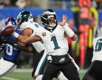 Philadelphia Eagles' Jalen Hurts plays during the first half of an NFL football game against the New York Giants Thursday, Oct. 9, 2025, in East Rutherford, N.J. (
