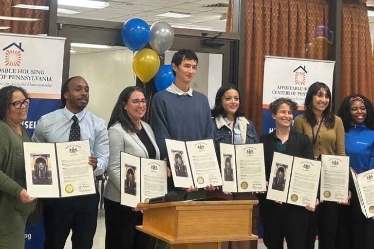 Staffers with the Will Power Program gathered Wednesday to celebrate the initiative helping 1,000 homeowners. (Aaron Moselle/WHYY)